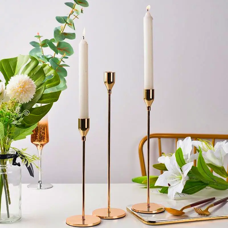 3-piece gold taper candle holder set for luxurious living room or dining decor.