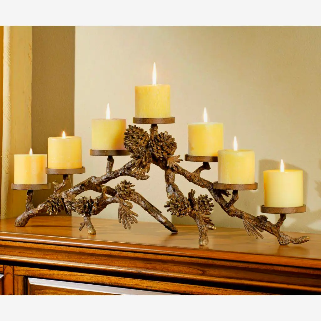 Aluminum pinecone mantelpiece candle holder for rustic fireplace or garden decor.