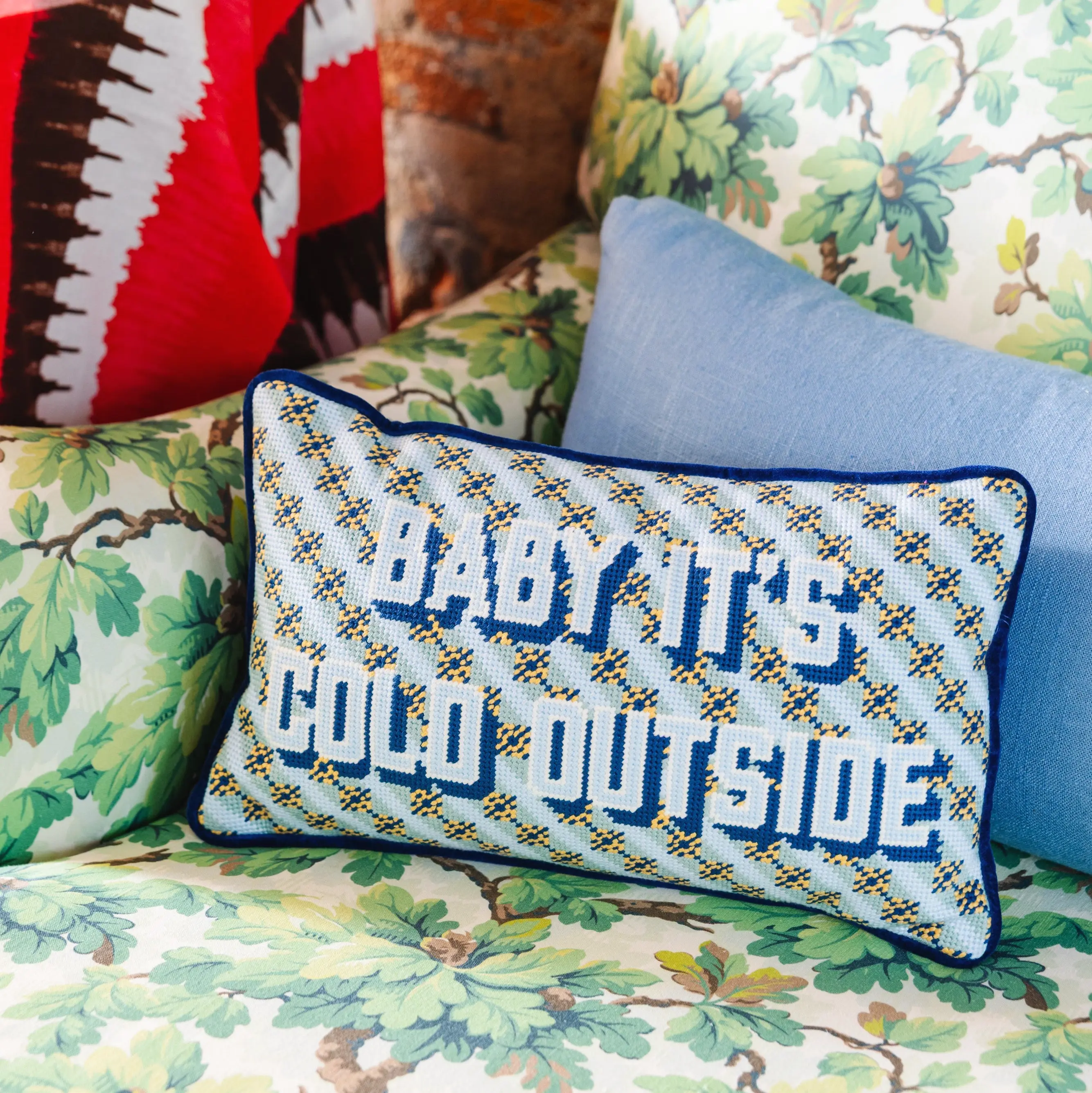 Baby It's Cold Outside holiday pillow for cozy winter living room.