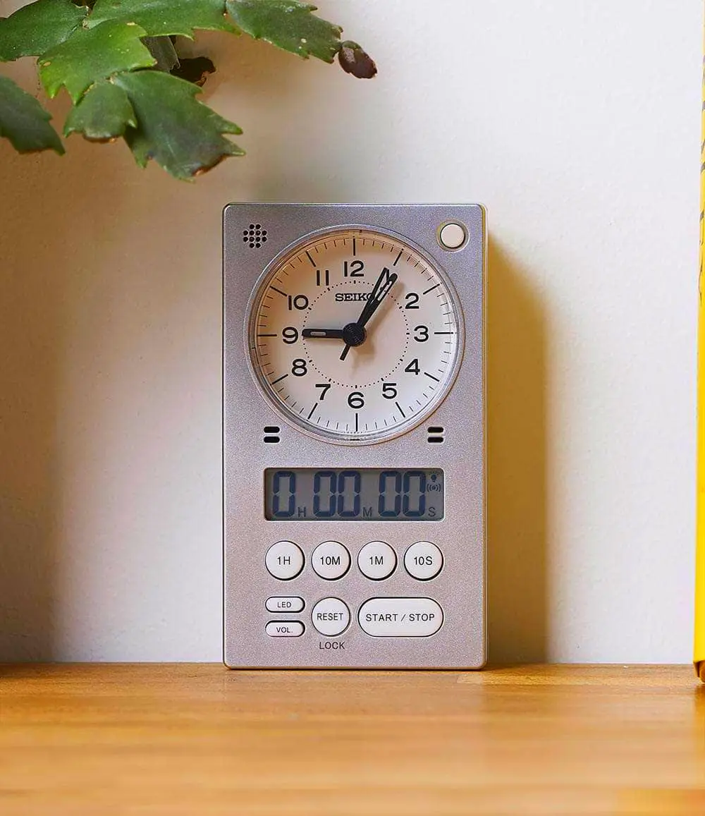 Silver and black kitchen timer clock for functional and stylish kitchen decor.