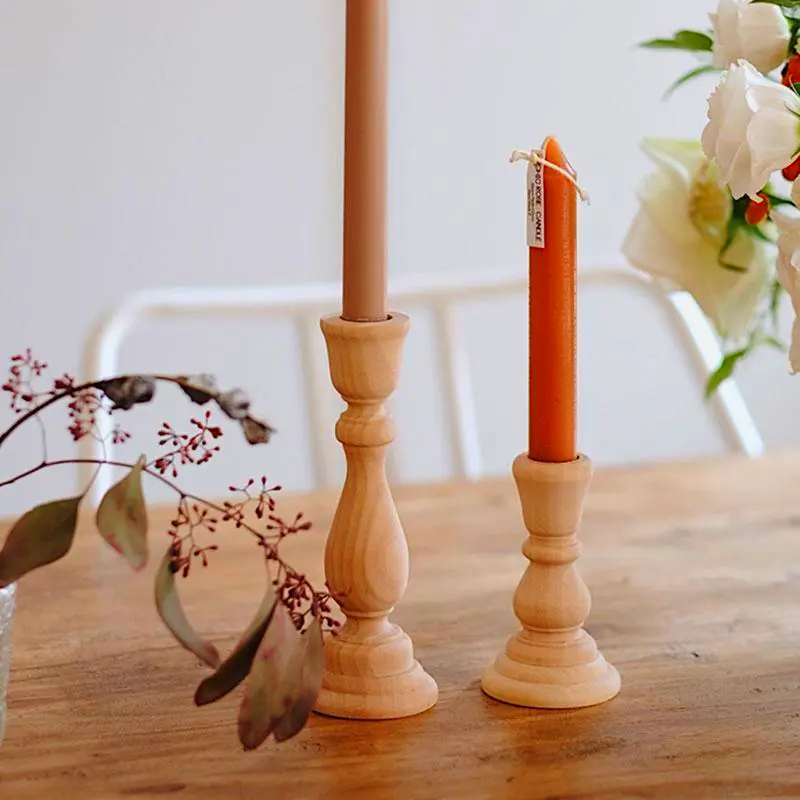 Classic wooden taper candle holders for rustic dining or garden decor.
