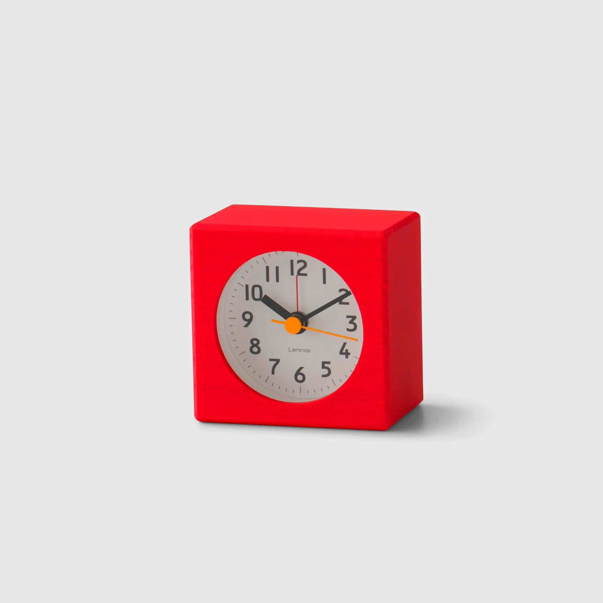 Classic red alarm clock for bedside desk or office. Adds a pop of color & functionality.