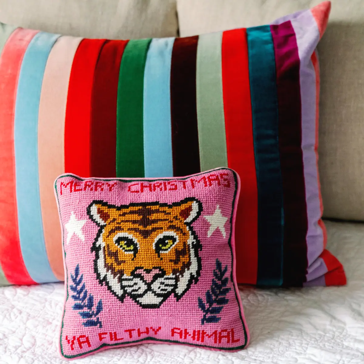 Filthy Animal holiday needlepoint pillow for festive home decor.