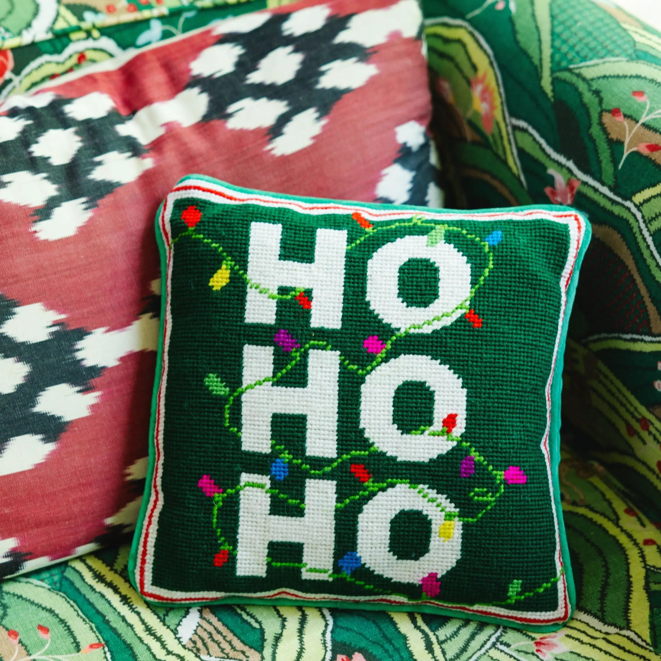 Ho Ho Ho holiday needlepoint pillow for festive couch decor.