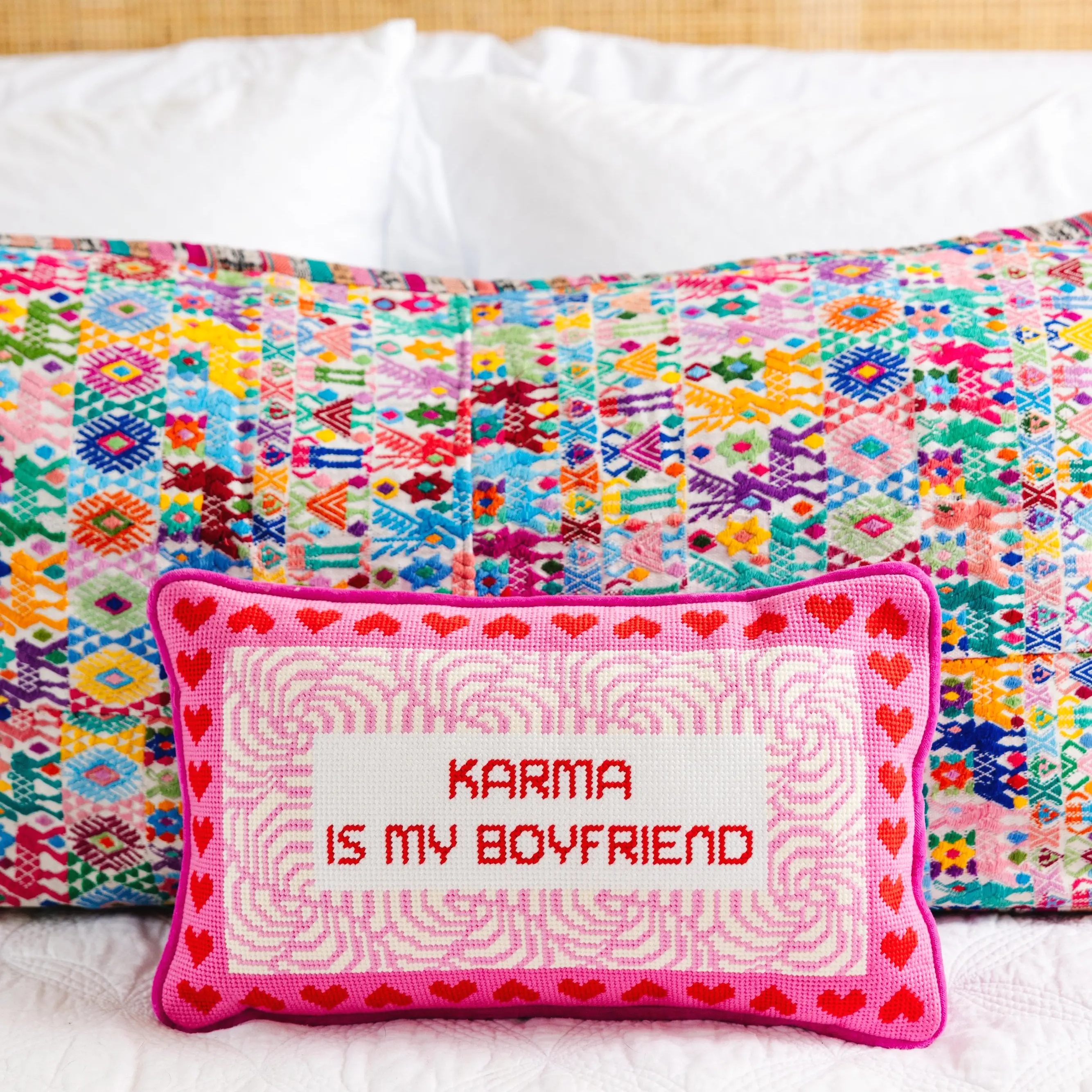 Karma needlepoint pillow for spiritual bedroom or yoga room.