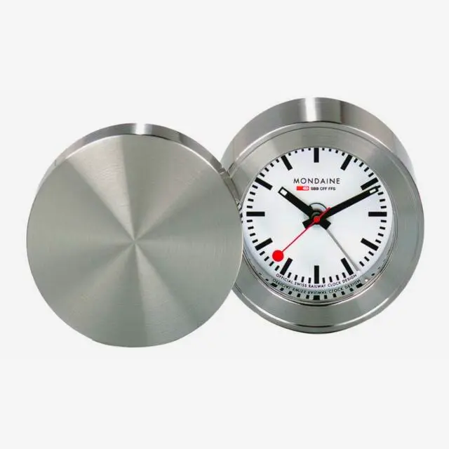 Compact mini travel alarm clock with backlight perfect for bedside tables offices or travel convenience.