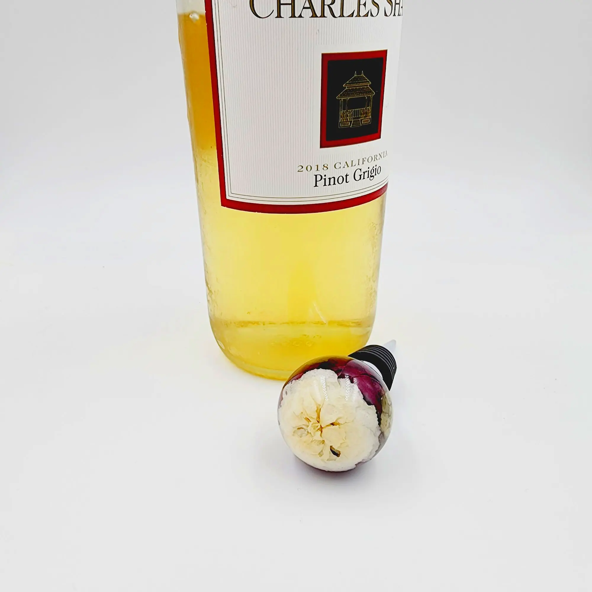 Resin sphere wine stopper. Elegant floral keepsake gift for wine lovers.