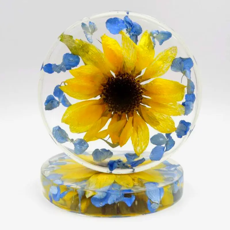 Round pressed flower paperweight. Resin keepsake home decor accent.