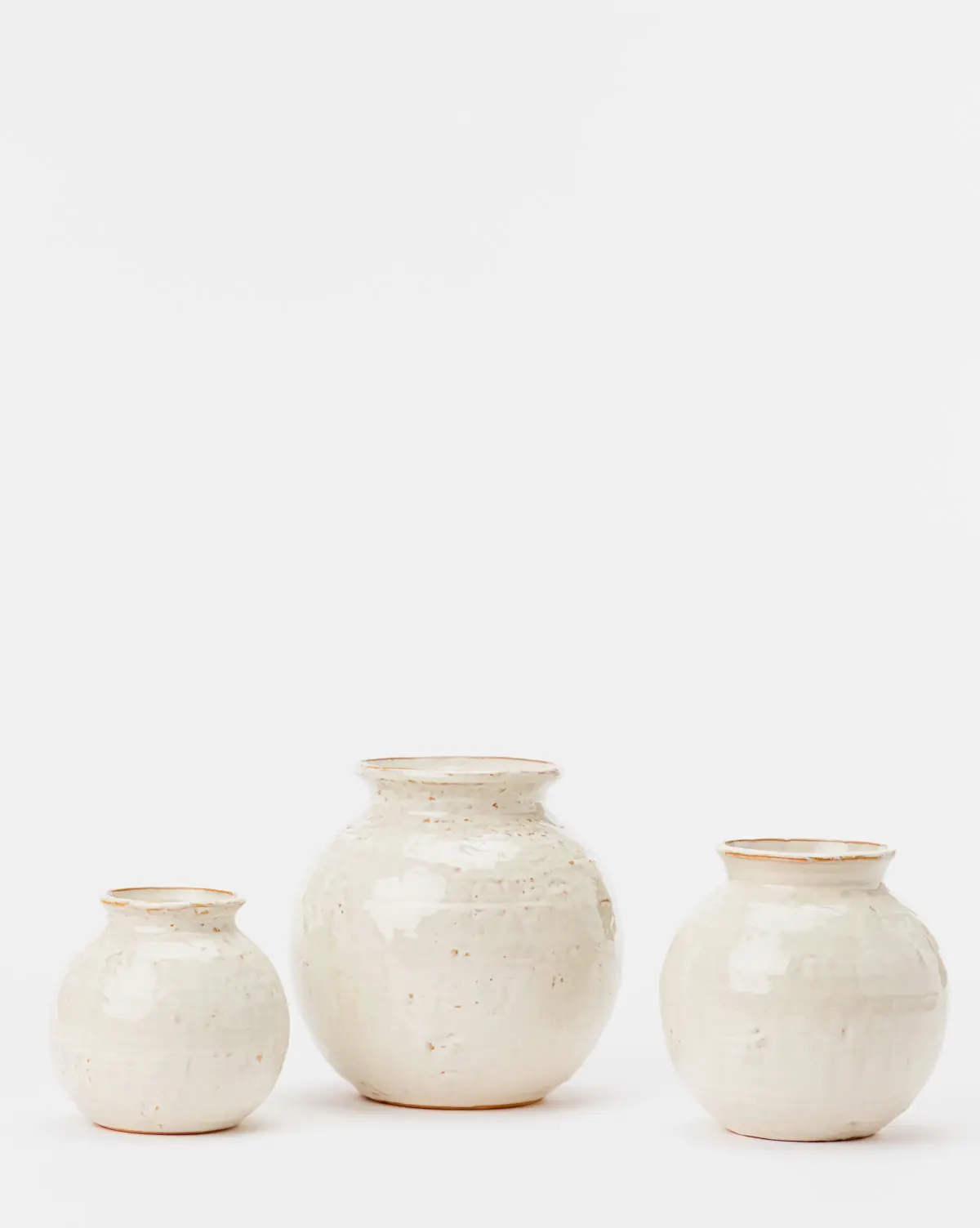 Rounded ceramic vase for flowers. Available in small, medium, large sizes.