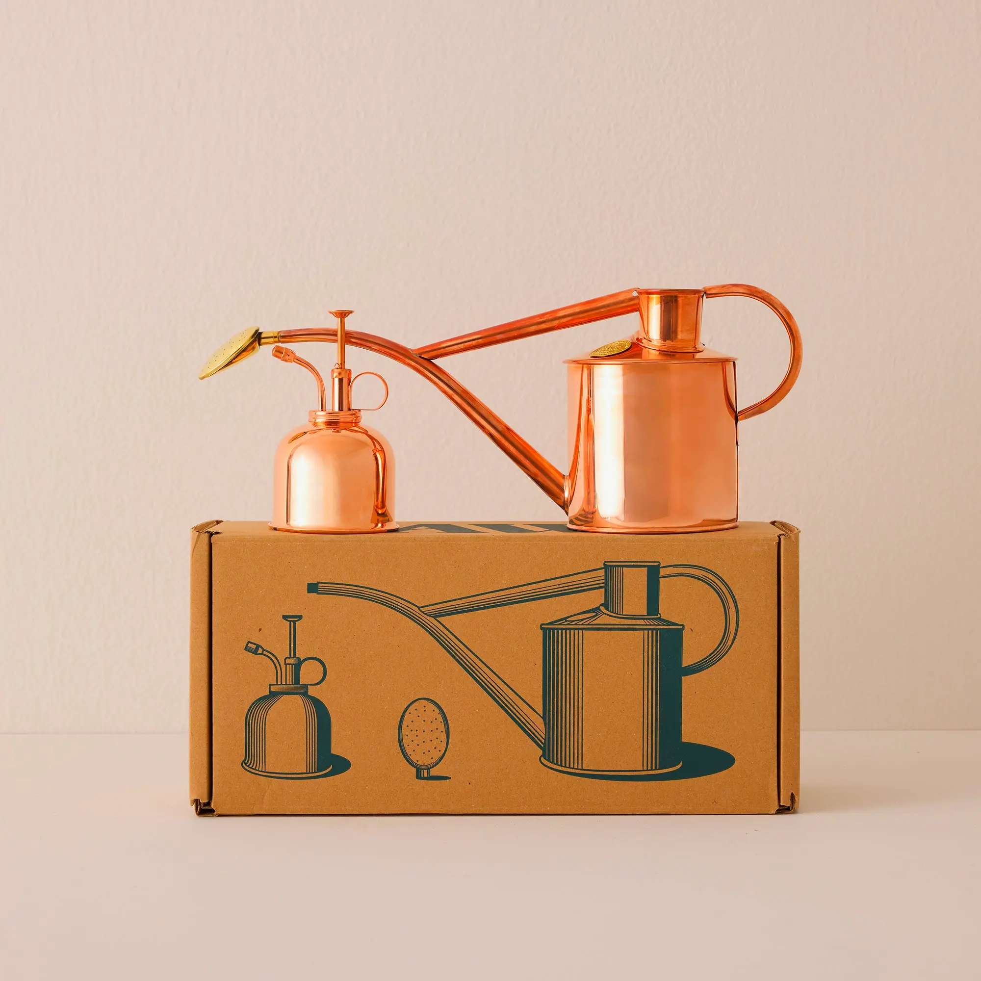 Rowley Ripple & Smethwick copper spritzer set for elegant garden and plant watering.