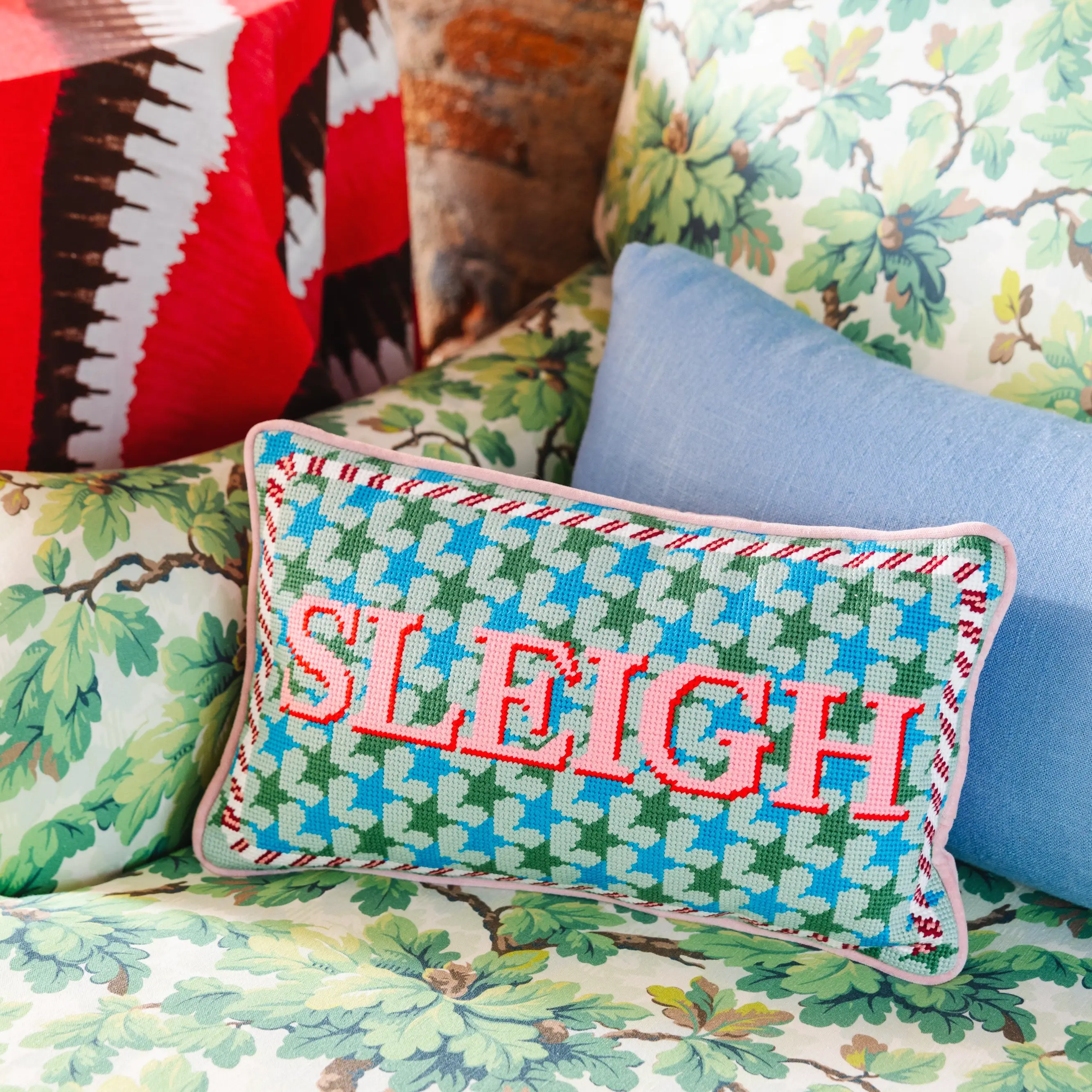 Sleigh holiday needlepoint pillow for Christmas home decor accent.