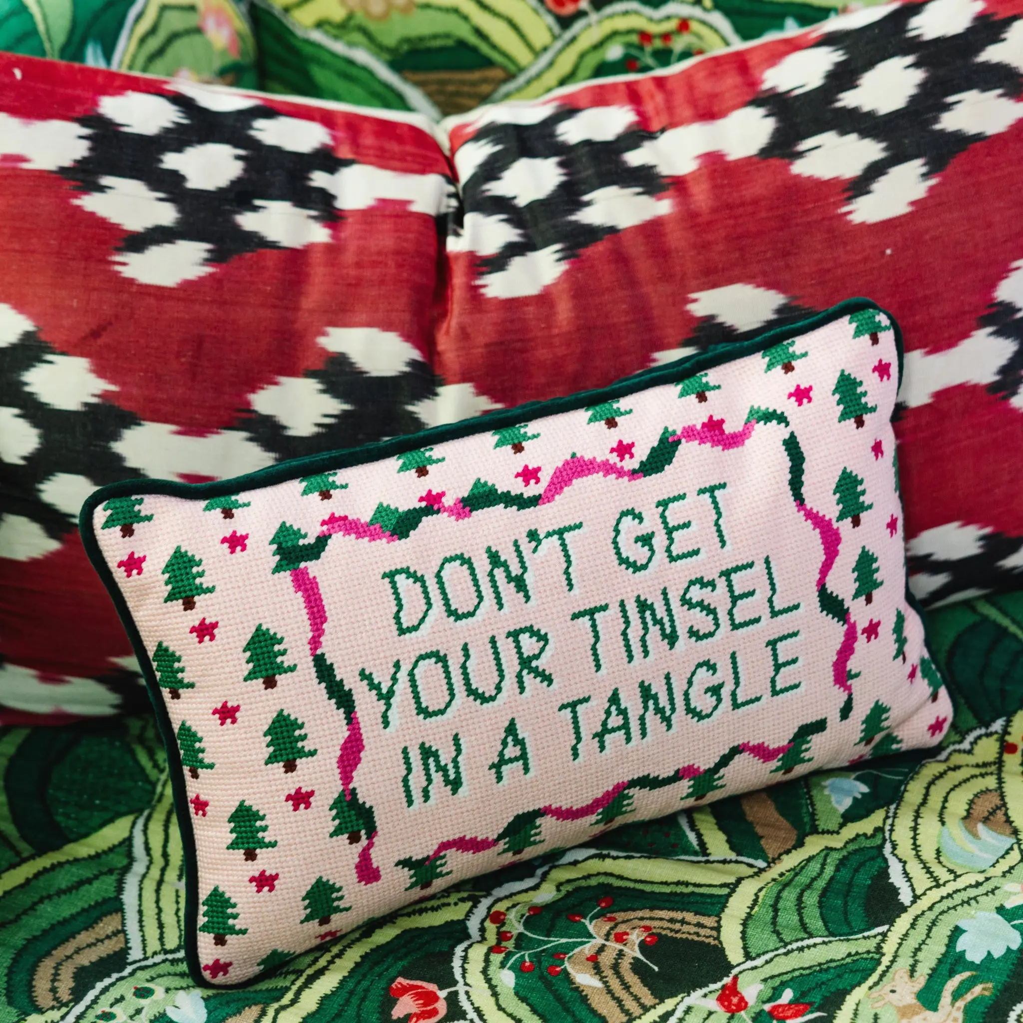 Tinsel in a Tangle holiday pillow for humorous Christmas decor.