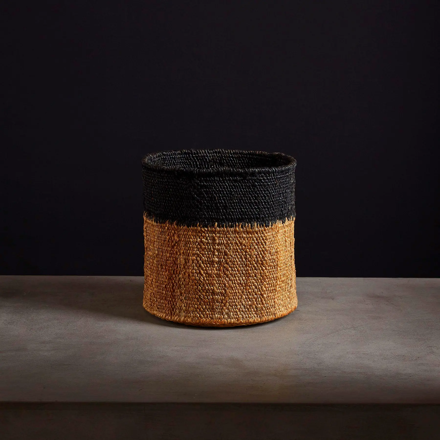 Tipped jute basket in natural black 12x12 – sustainable storage solution for home, office, or rustic interior decor.
