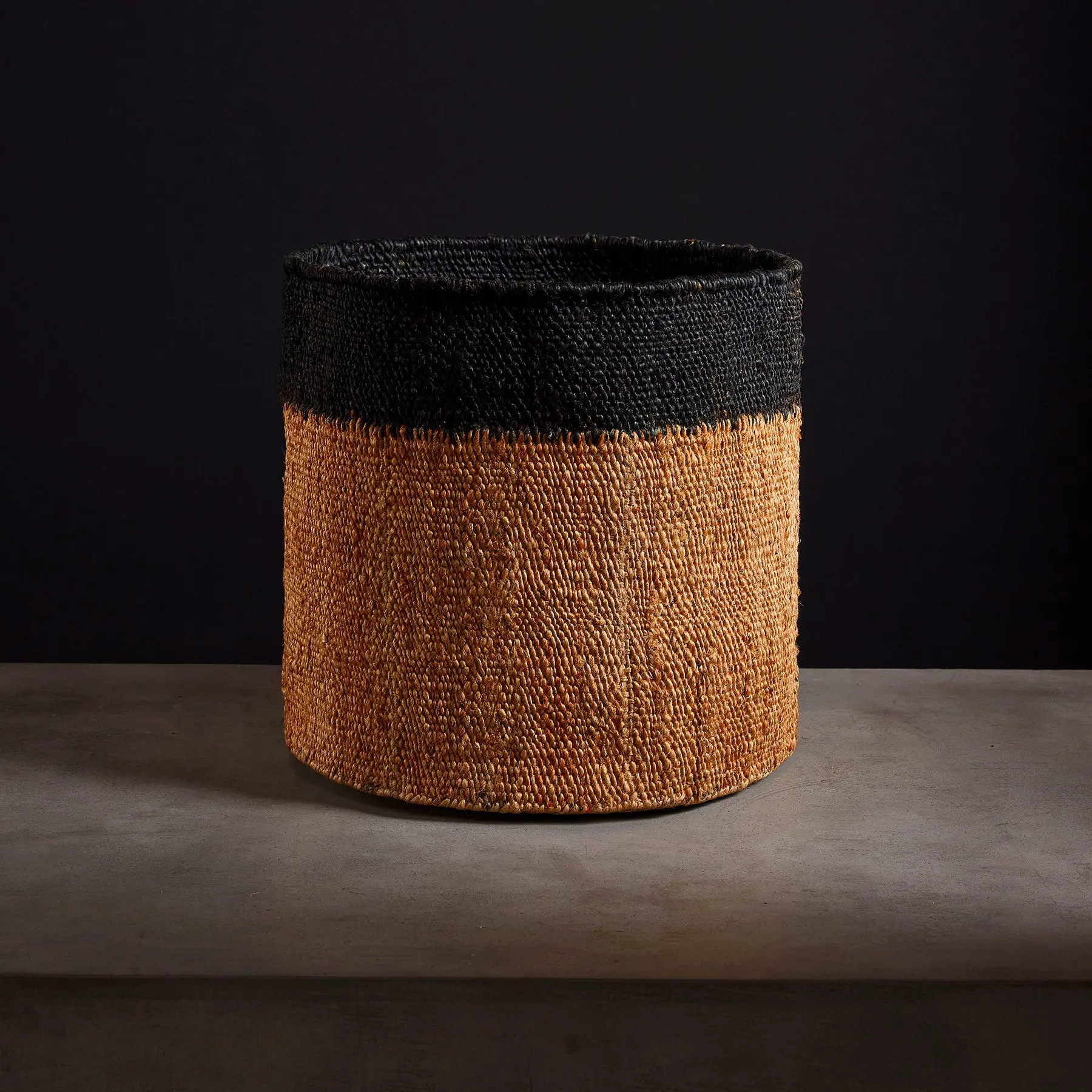 Tipped jute basket in natural black 18x16 – ideal for eco-friendly home storage in entryway, office, or living space.