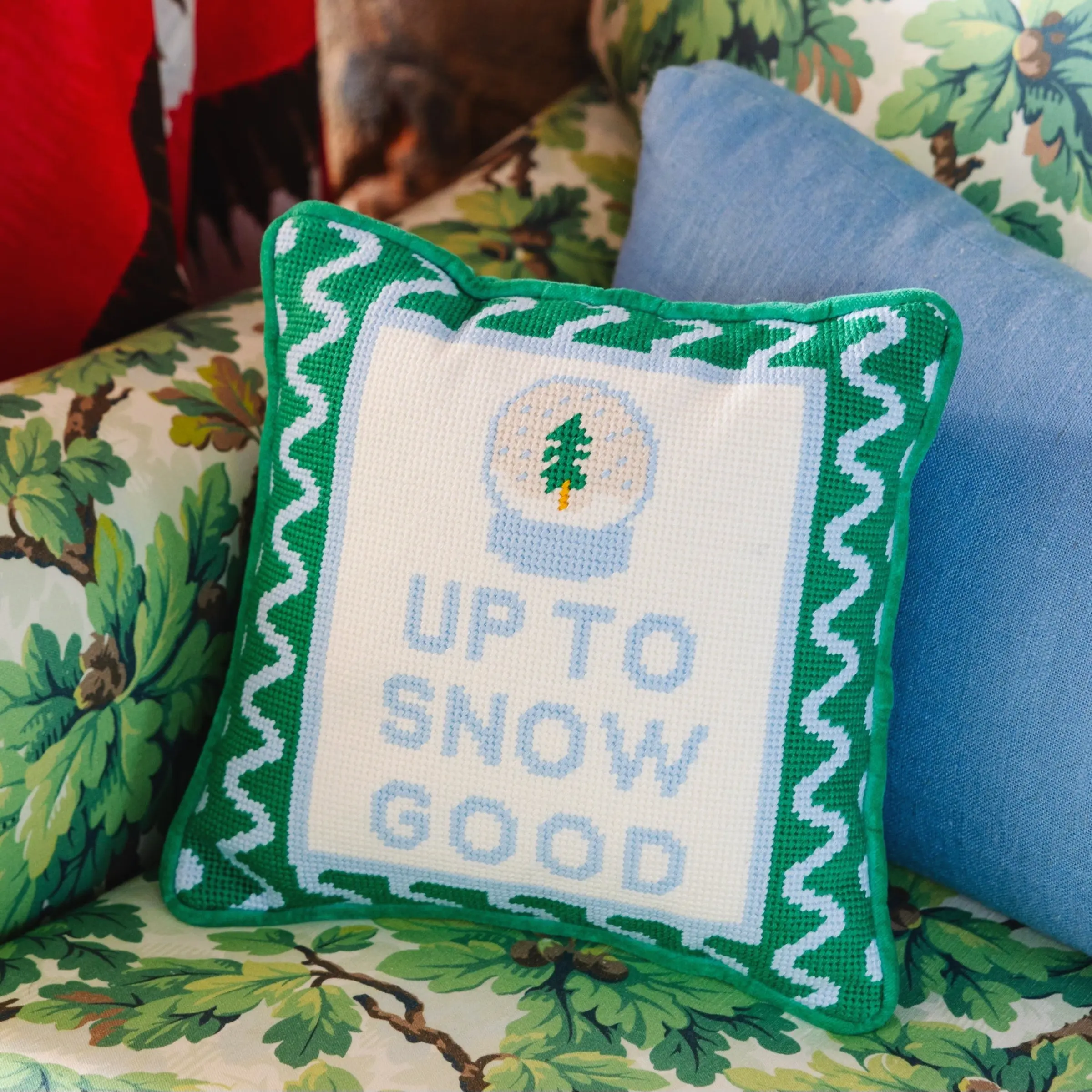 Up to Snow Good holiday pillow for whimsical winter living room.