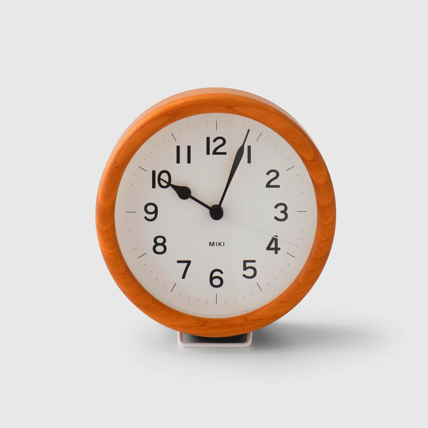 Versatile wooden clock for table or wall. Ideal for rustic modern or minimalist home decor.
