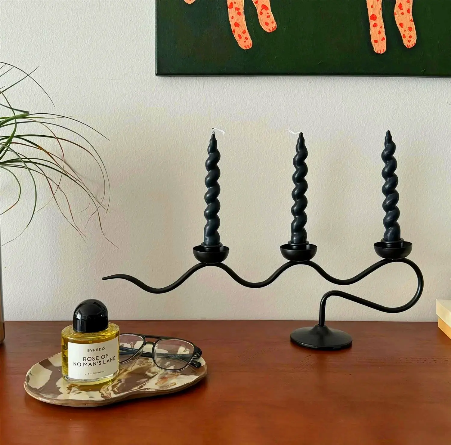 Wrought iron wavy candle holder in black & white great for modern home decor coffee tables or mantle displays.
