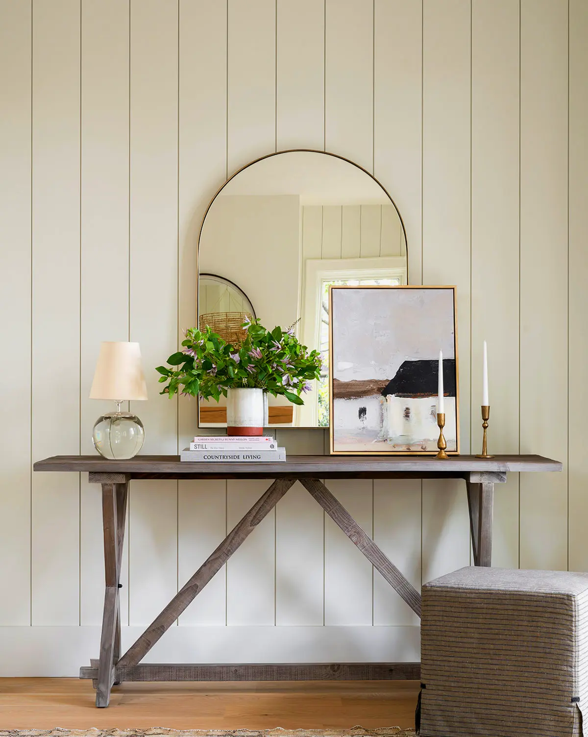 Wylie arched wall mirror in matte black, antique brass, or polished nickel, a statement piece for bedrooms and hallways.